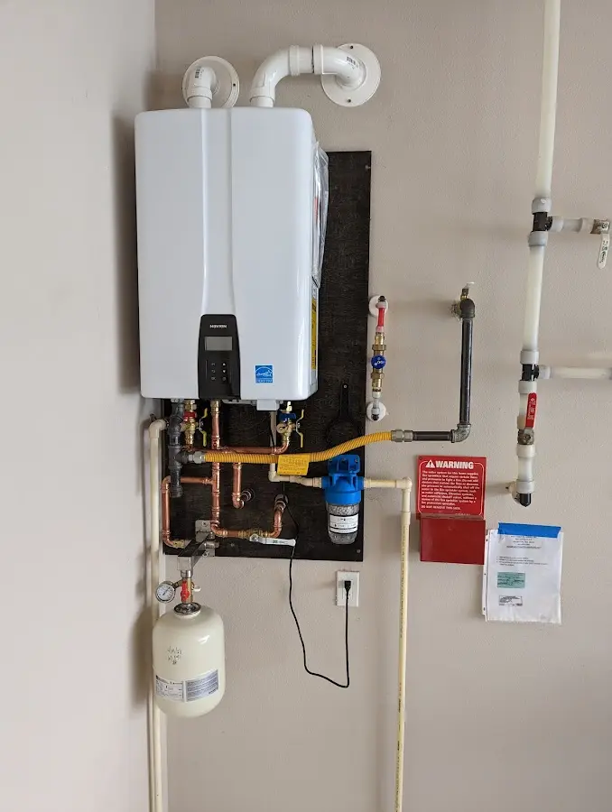 Professional plumber installing copper piping in a Park Rapids home